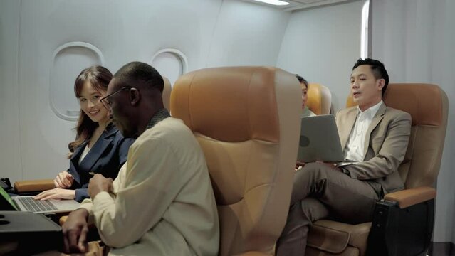 Passengers seated in the cabin of an airline during a trip,Businessman traveling by plane.
