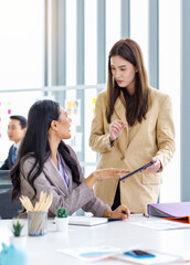 Asian young female professional successful businesswoman mentor teaching training helping...