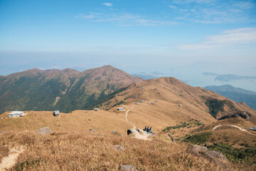 Group of hikers on resting on path to the Sunset Peak, Hong, Kong