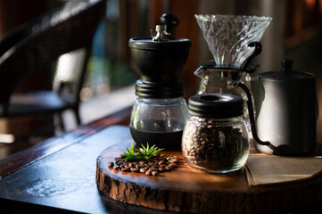 Iced coffee cup with ice and coffee beans on old wooden floor