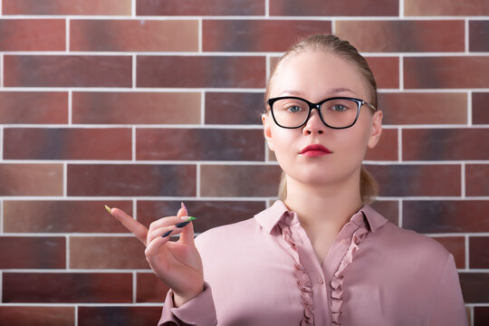 Portrait of a girl pointing her finger to the side