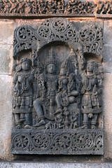 Stone Sculpture of Beautiful Female (Madanikas) with selective focus, 12th century Hindu temple, Ancient stone art and sculptures in each pillars, Chennakeshava Temple, Belur, Karnataka, India.