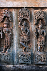 Stone Sculpture of Beautiful Female (Madanikas) with selective focus, 12th century Hindu temple, Ancient stone art and sculptures in each pillars, Chennakeshava Temple, Belur, Karnataka, India.