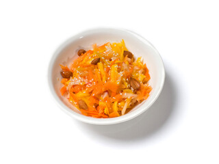 Pumpkin salad in a white plate on a white background. Studio photography. View from above