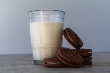 Chocolate chip cookies with milk on a light background. Chocolate sandwich - cookies.
