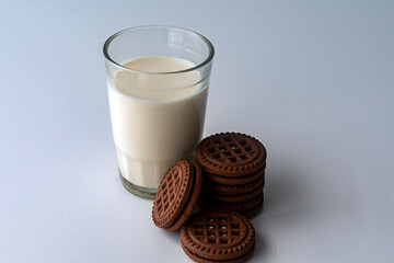 Chocolate chip cookies with milk on a light background. Chocolate sandwich - cookies.