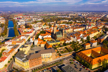 Fototapeta na wymiar Panoramic aerial view of autumn Hradec Kralove townscape with Renaissance clock tower and Gothic Cathedral on sunny day, Czech Republic..