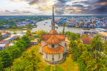 Aerial view of the famous Cai Be church in the Mekong Delta, Roman architectural style. In front is...
