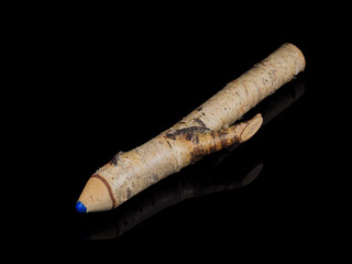 Blue pencil stylized from a branch isolated on a black background