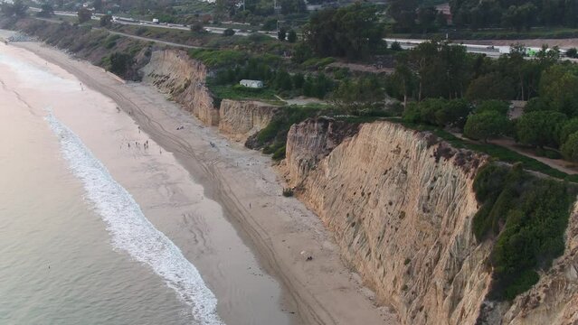 High aerial over Montecito beach, coastal bluffs, and ocean