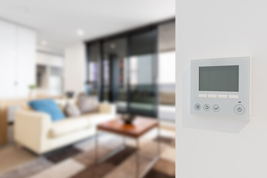 Home security video doorbell with temperature controller and indoor blur background
