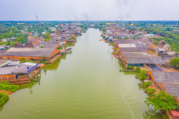 Aerial view of Mang Thit brick kiln in Vinh Long. Burnt clay bricks used in traditional...
