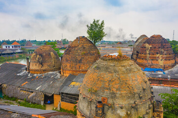 Aerial view of Mang Thit brick kiln in Vinh Long. Burnt clay bricks used in traditional...
