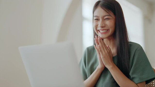 Excited asian female feeling euphoric celebrating online win success achievement result, young woman happy about good email news, motivated by great offer or new opportunity, passed exam, got a job