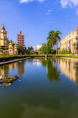 Fototapeta premium Beautiful day in Vinh Trang Pagoda in My Tho city, the Mekong Delta, Vietnam.