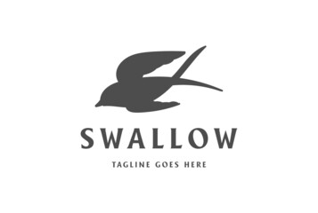Fototapeta premium Simple Minimalist Flying Swallow Bird Silhouette Logo Design Vector