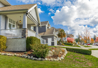Entrance of a luxury house with a patio. Home exterior with patio area with nice landscaping desing around
