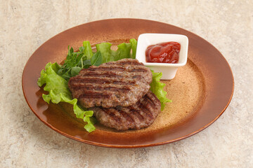 Grilled beef burger cutlet with sauce