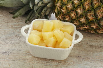 Marinated pineapple slices in the bowl