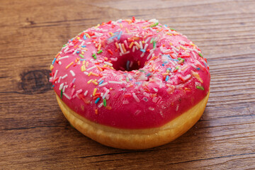Sweet glazed struwberry donut with icing