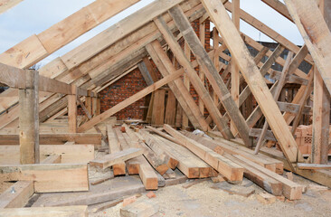 Roofing construction and framing of a new house. Timber trusses, roof framing with a close-up of...