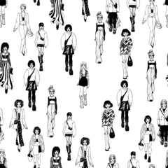 Seamless pattern. Women in trendy clothes. Defile sketch.