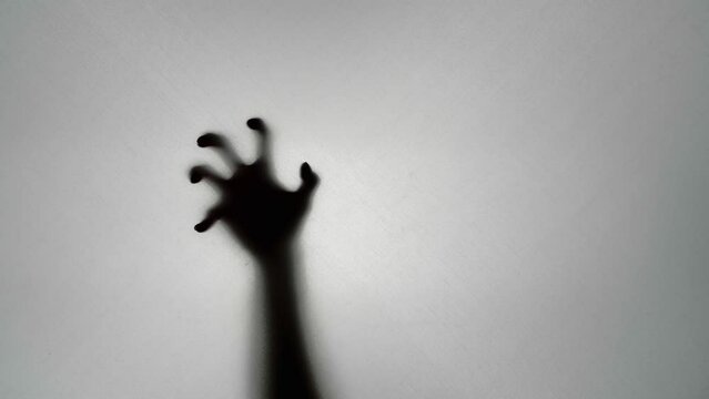 Abstract And Spooky Defocused Hand On White Background
