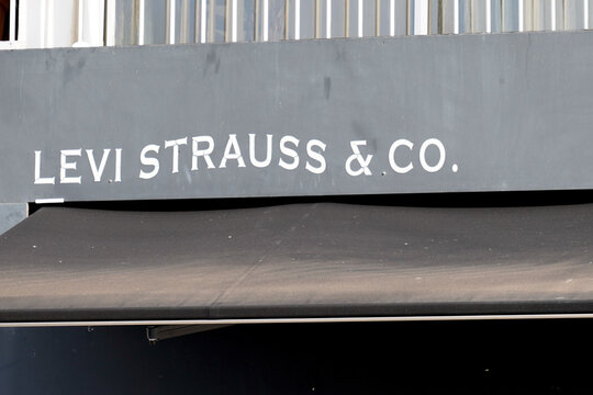 Levi strauss & co text sign and brand logo front of Jeans shop fashion boutique of trendy levis store
