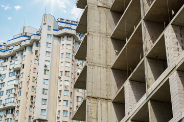 construction of a modern high-rise building, concrete frame and building materials