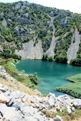 Fototapeta na wymiar blue lake in the Krupa river, Croatia