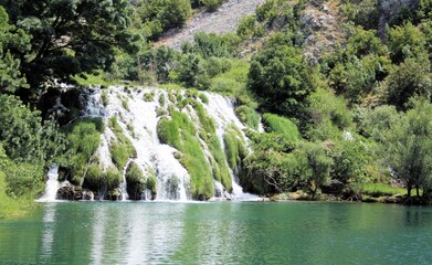 Fototapeta na wymiar a waterfall in the lake of the Krupa river, Croatia