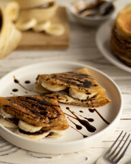 Pancakes with banana and chocolate topping