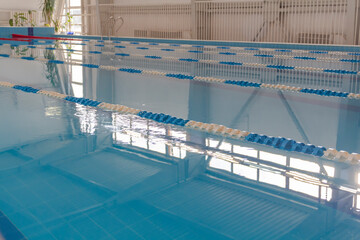 Swimming pool with clean water in the sports complex for athletes young and old.