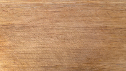 fragment of an old rough board of light oak with horizontal fibers textured, background, top view