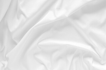 Obraz premium White fabric texture background. Cloth soft wave. Creases of satin, silk, and cotton.