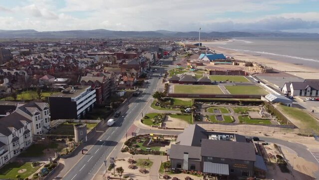 An aerial view of the seaside resort of Rhyl, flying along the promenade towards the town centre on a sunny spring morning, , Denbighshire, Wales, UK.