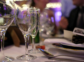 Restaurant table with spotlights ready for dinner guests