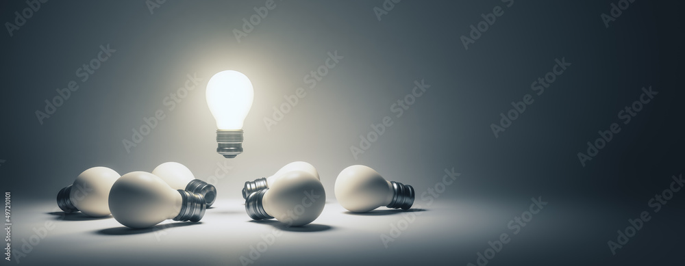Poster abstract illuminated lamps on wide gray background with mock up place. idea, teamwork and leadership