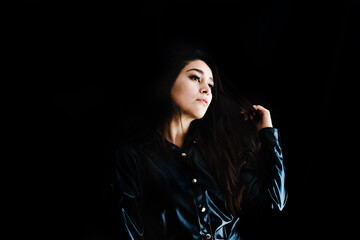 young latin woman portrait on black background in Mexico Latin America