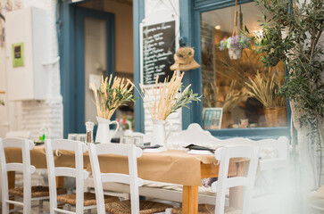 Greek tavern in the center of Ermoupolis in Syros great place to eat. Wheat ears placed on the table of the Greek tavern laying on top is both aesthetically pleasing and reminiscent of days past
