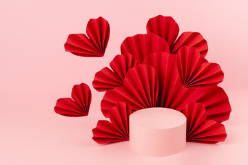 Fashion bright romance pink scene mockup with one cylinder podium, soar red origami paper hearts on...