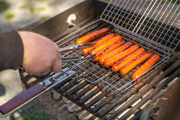Sausages are cooked on the grill.
bbq party.