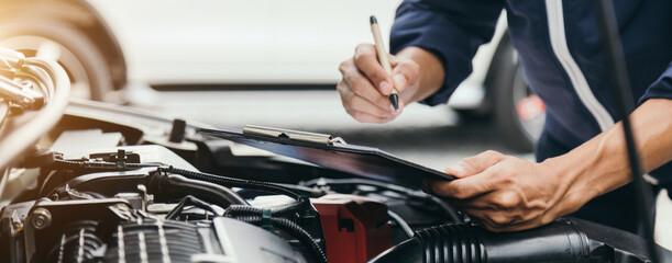 Automobile mechanic repairman hands repairing a car engine automotive workshop with a wrench, car service and maintenance,Repair service.