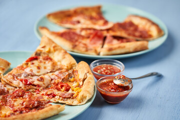Pizza slices on blue background