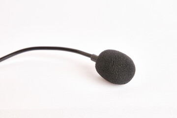 Microphone with wind protection on a white background.