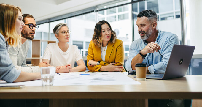 Group of multicultural designers having a meeting in an office