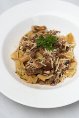 Fettuccine pasta with beef and parmesan cheese