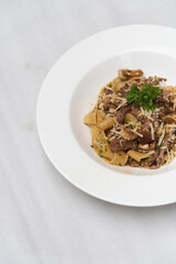 Fettuccine pasta with beef and parmesan cheese