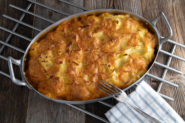Potato gratin with cheese topping  and delicious ground beef vegetable filling