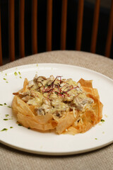 Fried shrimps and mushrooms with creamy cheese